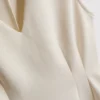 Αμάνικο τοπ με V-neck και πεπλούμ