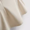Αμάνικο τοπ με V-neck και πεπλούμ
