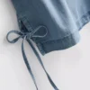 Μπλούζα χωρίς μανίκια από βαμβακερό τζιν με δέσιμο στα πλάγια