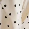 Μπλούζα με πεπλούμ και λαιμόκοψη halter με πουά