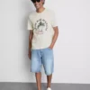 T-shirt με γραφικό «Paradise Beach»