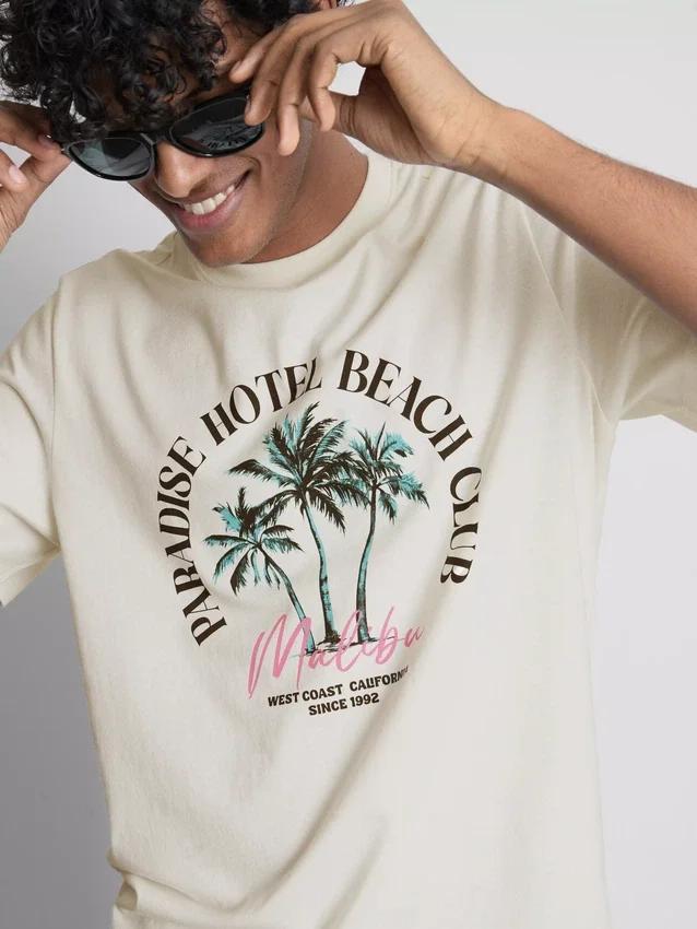T-shirt με γραφικό «Paradise Beach»