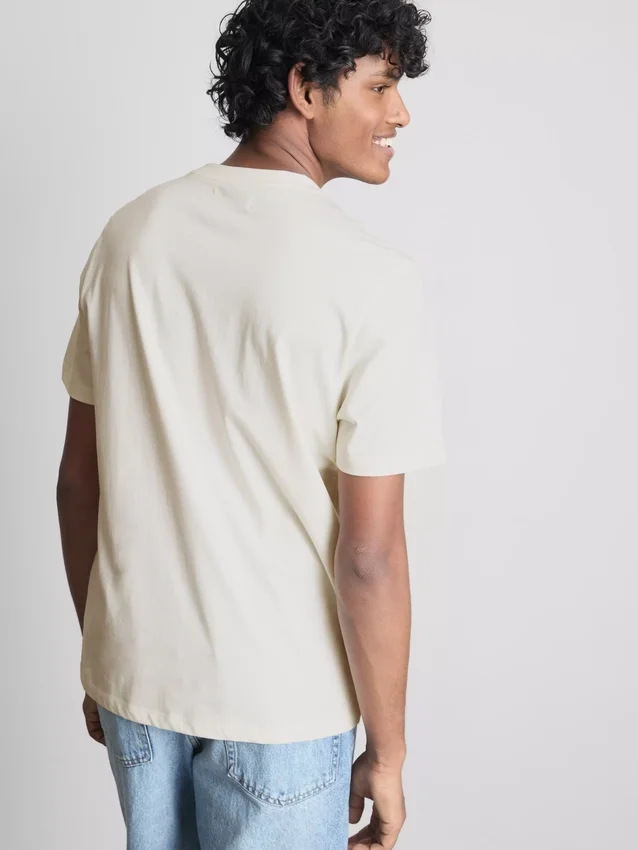 T-shirt με γραφικό «Paradise Beach»