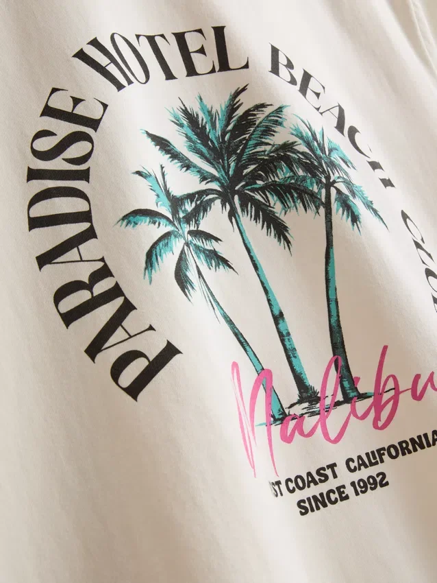 T-shirt με γραφικό «Paradise Beach»