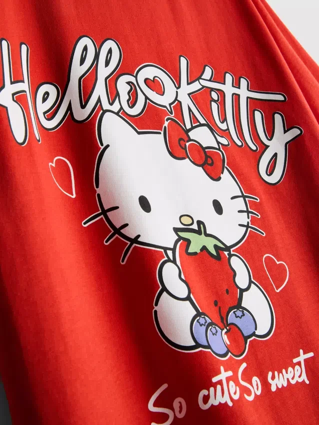 Βαμβακερό φανελάκι Hello Kitty με χαλαρή εφαρμογή και μοτίβο φράουλας